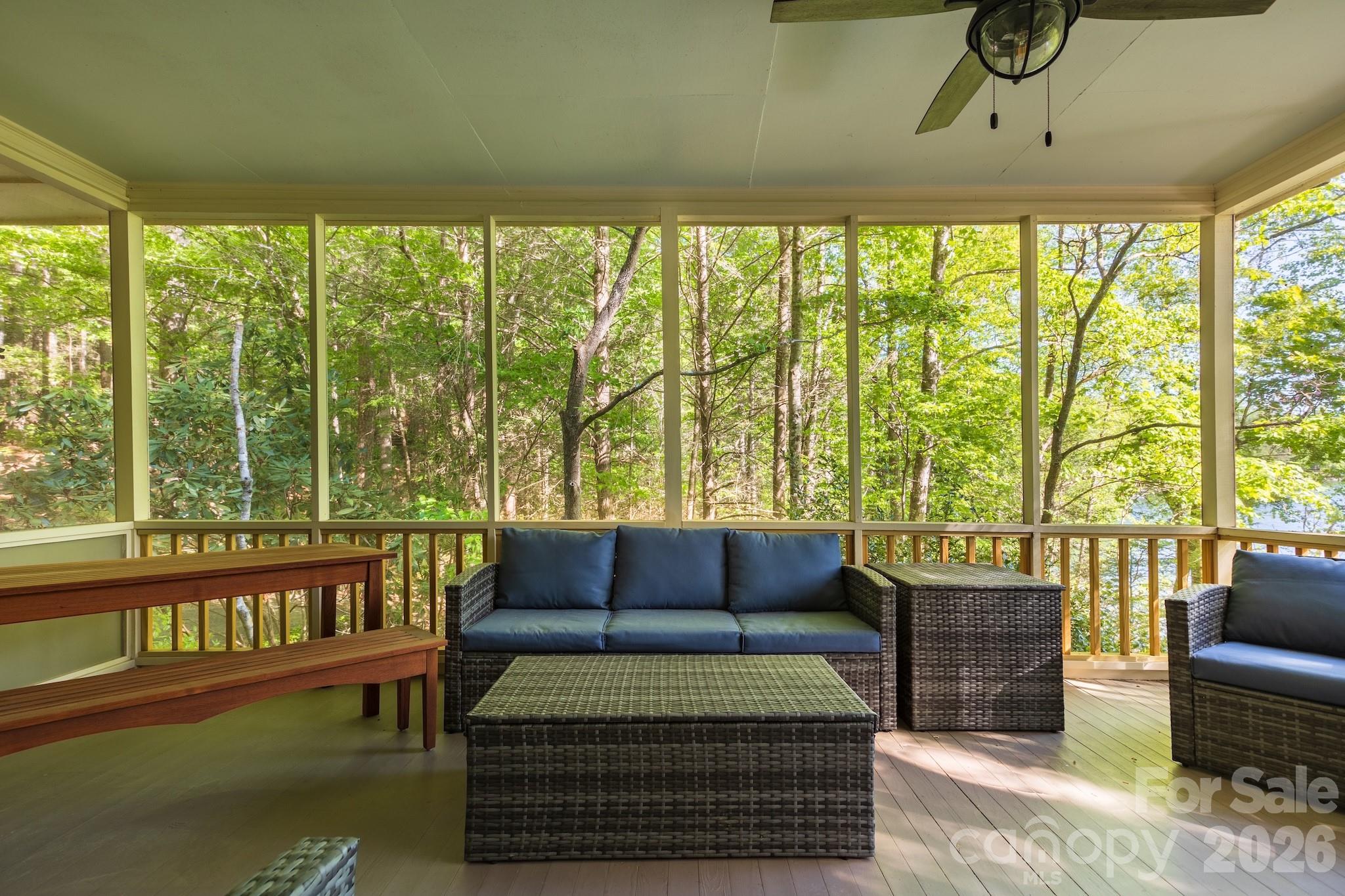 1971 Buffalo Creek Road Lake Lure, NC 28746 - Photo 5 of 31 a living room with furniture and a large window