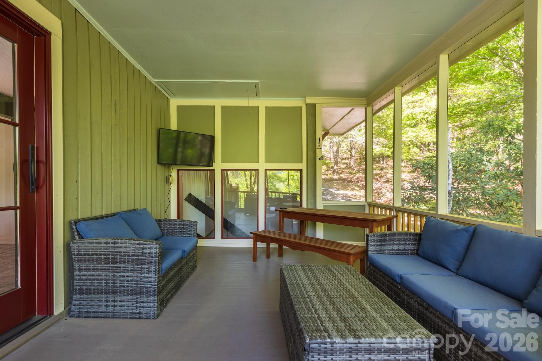 1971 Buffalo Creek Road Lake Lure, NC 28746 - Photo 6 of 31 a living room with furniture and a large window