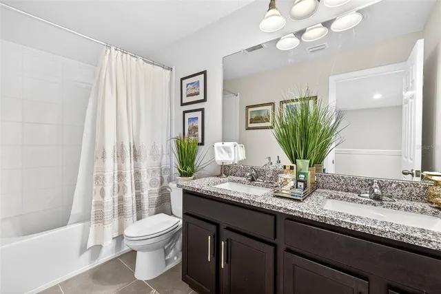 an aerial view of a house with yard swimming pool and outdoor seating