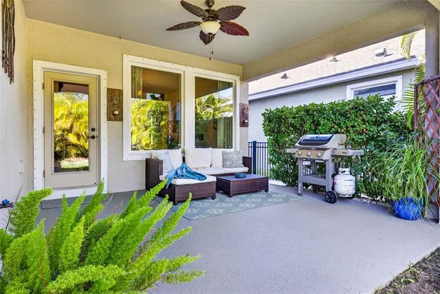 an aerial view of a house with a yard basket ball court and outdoor seating