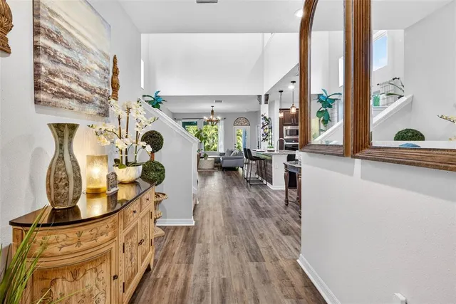 a kitchen with stainless steel appliances granite countertop a sink and a refrigerator