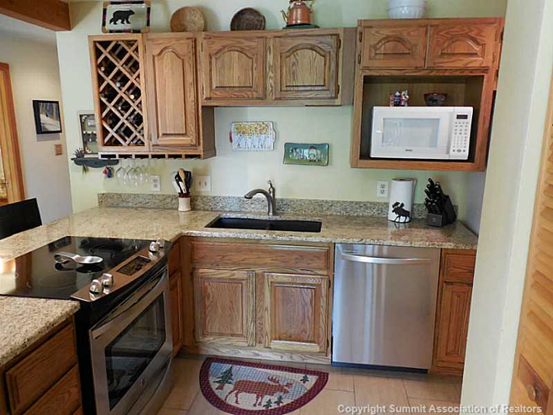 91300 Ryan Gulch Road, Unit 307 Silverthorne, CO 80498 - Photo 1 of 25 Kitchen. Upgraded with slab granite counter