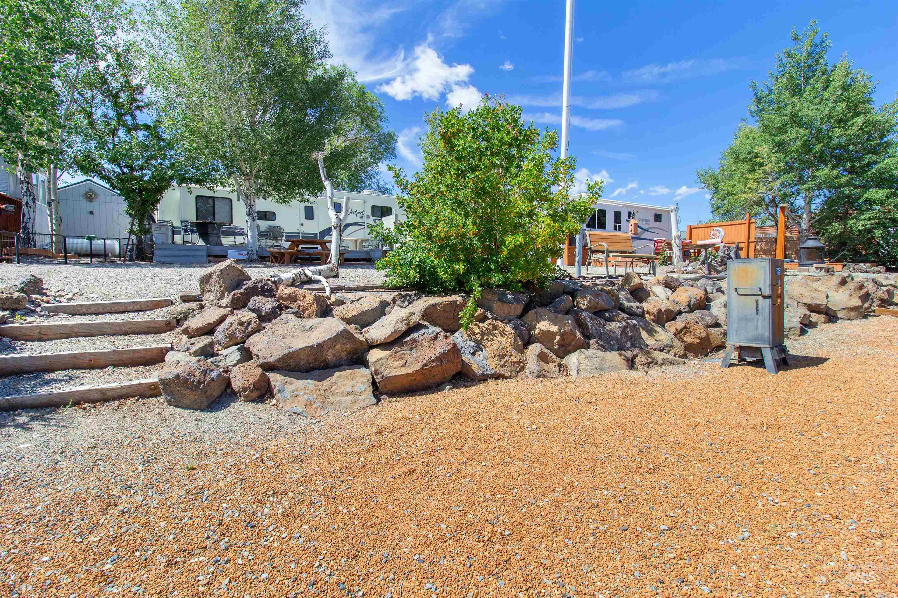 106 West Magic Road Shoshone, ID 83352 - Photo 34 of 45 Terraced landscape featuring natural stone rock walls and gravel pathways