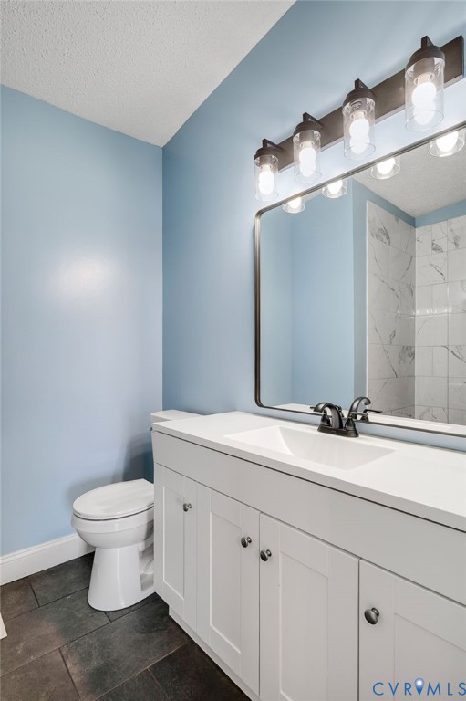 9711 Robin Road Disputanta, VA 23842 - Photo 23 of 29 a bathroom with a toilet sink and mirror