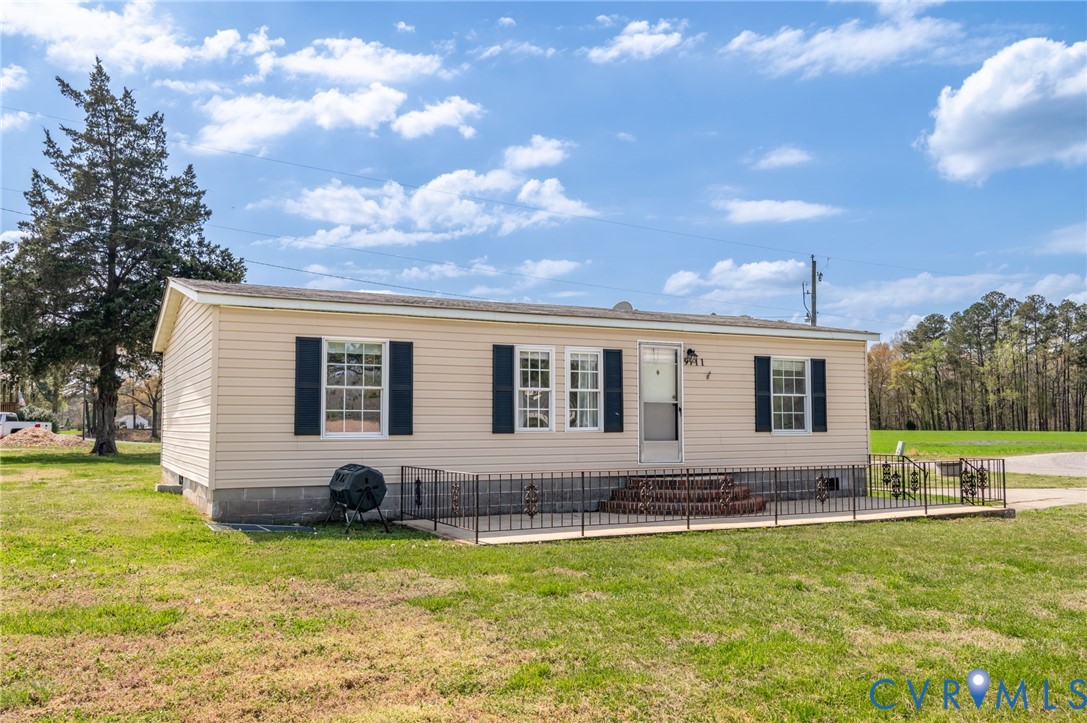 9711 Robin Road Disputanta, VA 23842 - Photo 3 of 29 a front view of house with yard having outdoor seating