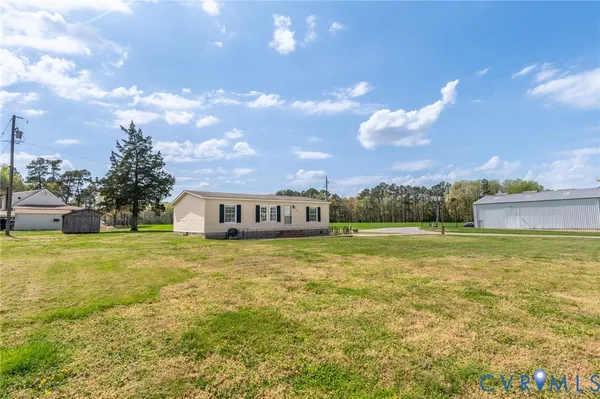 a view of a house with a big yard