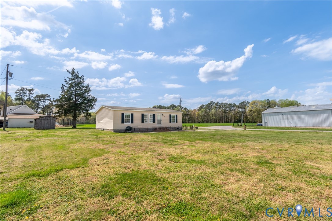 9711 Robin Road Disputanta, VA 23842 - Photo 4 of 29 a view of a house with a big yard