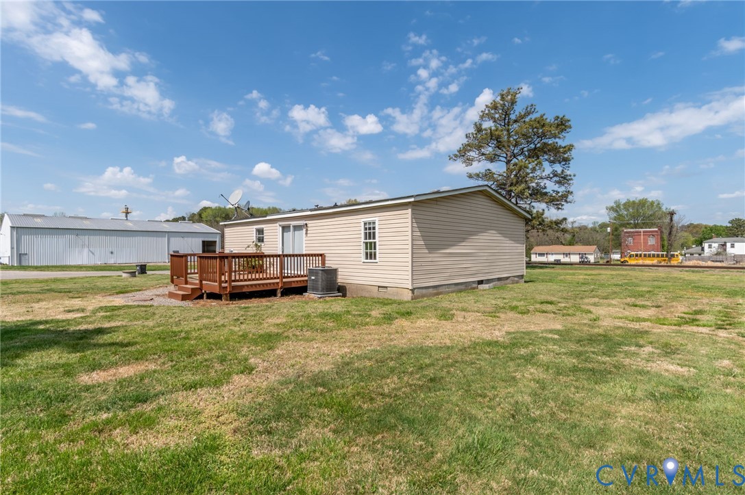 9711 Robin Road Disputanta, VA 23842 - Photo 7 of 29 a backyard of a house with table and chairs