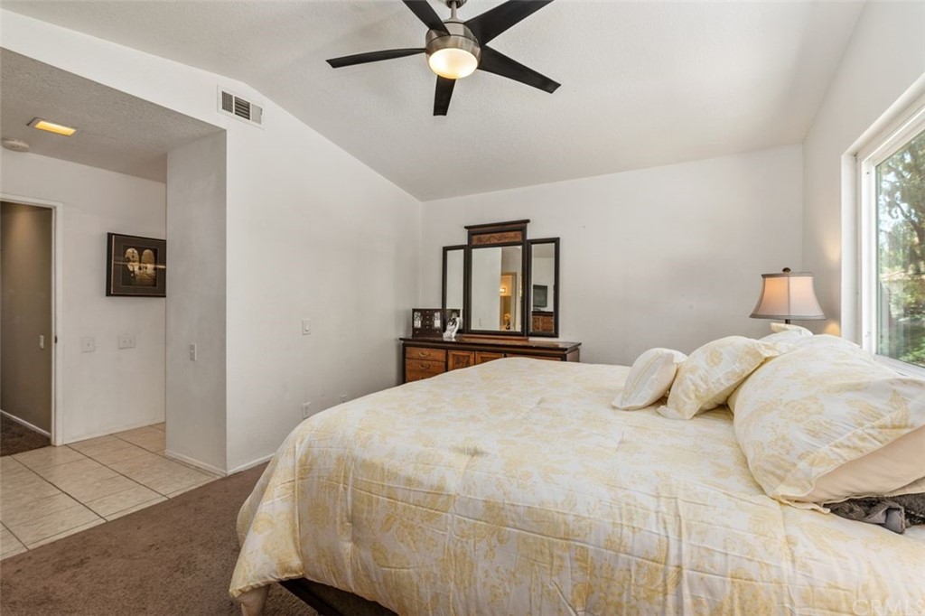 28825 Woodspring Circle Lake Forest, CA 92679 - Photo 19 of 50 a bedroom with a bed and window