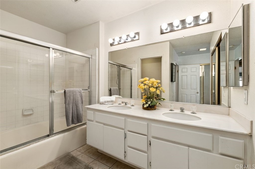 28825 Woodspring Circle Lake Forest, CA 92679 - Photo 20 of 50 a bathroom with a double vanity sink and mirror