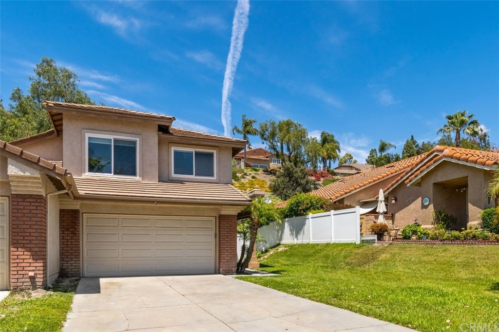 28825 Woodspring Circle Lake Forest, CA 92679 - Photo 2 of 50 a front view of a house with garden