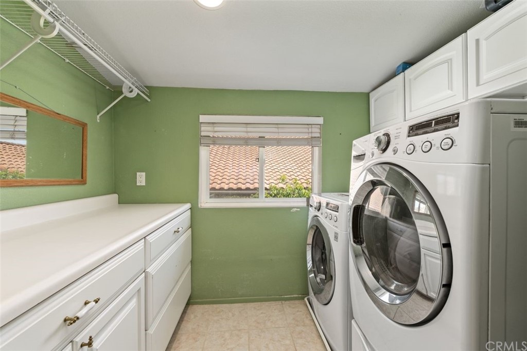 28825 Woodspring Circle Lake Forest, CA 92679 - Photo 26 of 50 a utility room with dryer and washer