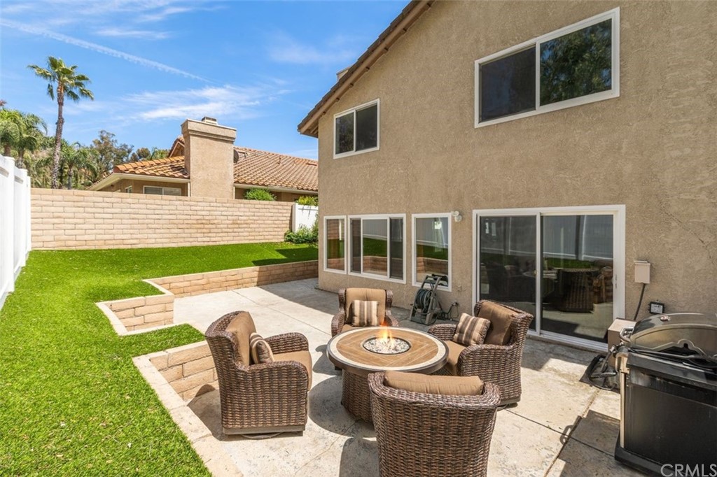 28825 Woodspring Circle Lake Forest, CA 92679 - Photo 29 of 50 a view of a patio with couches table and chairs and potted plants