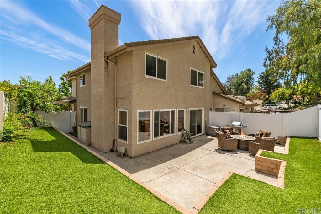 28825 Woodspring Circle Lake Forest, CA 92679 - Photo 30 of 50 a front view of a house with garden