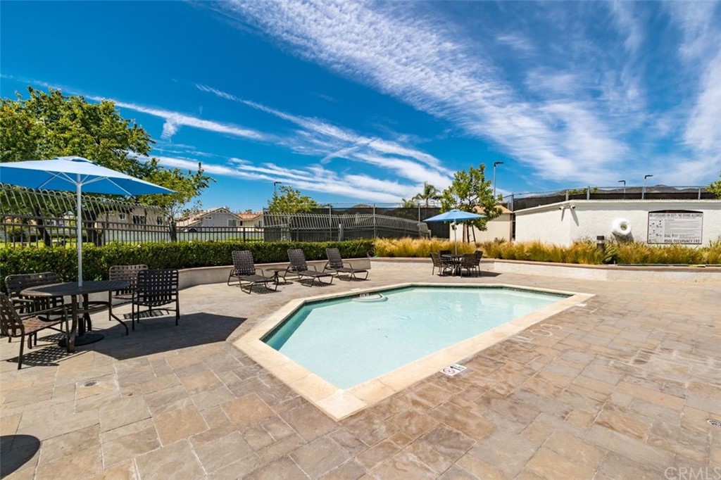 28825 Woodspring Circle Lake Forest, CA 92679 - Photo 40 of 50 a view of a swimming pool with chairs