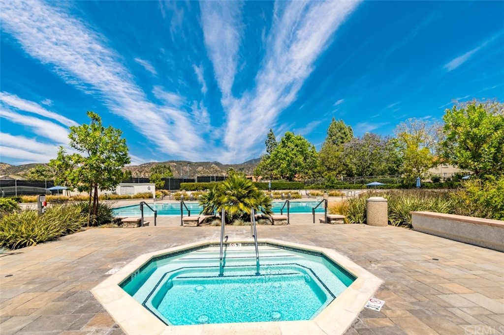 28825 Woodspring Circle Lake Forest, CA 92679 - Photo 41 of 50 a swimming pool with outdoor seating and yard