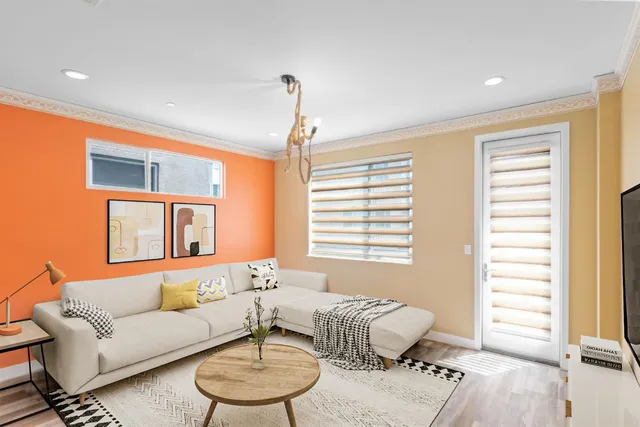a living room with furniture and a window