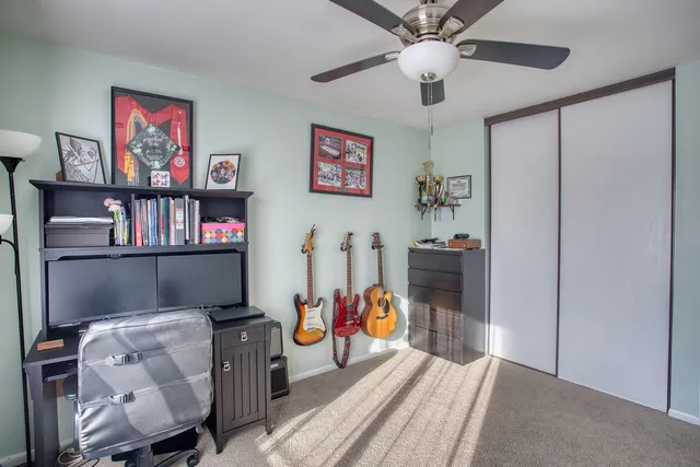 a view of a livingroom with furniture and workspace