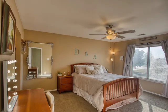 a bedroom with a bed and window