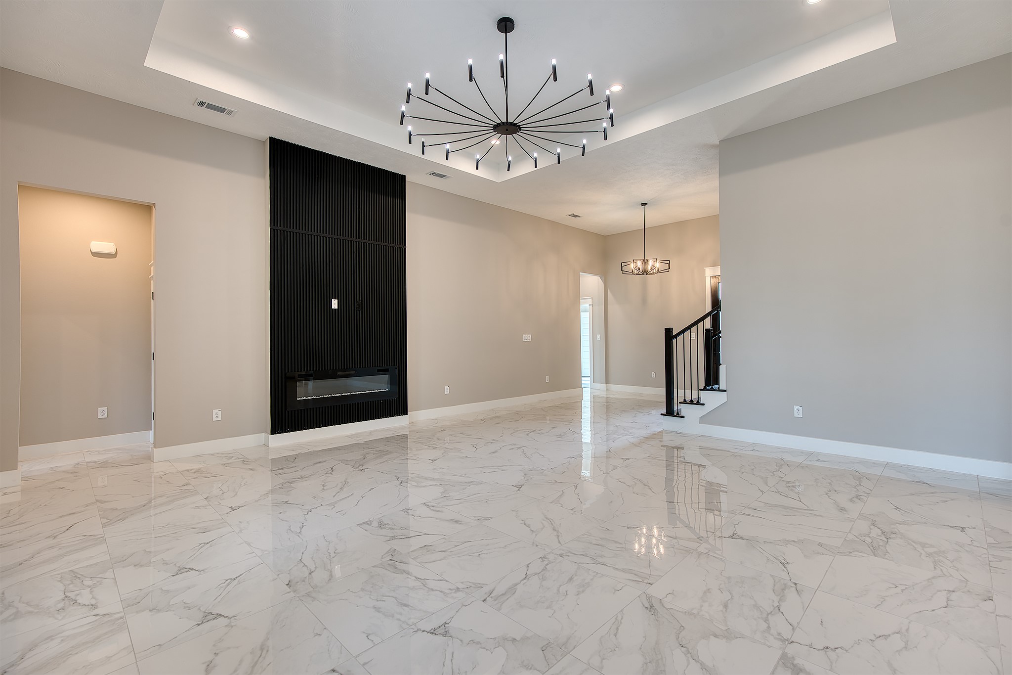 en view interior of a house with a chandelier fan and a bathroom