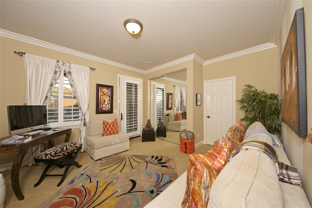 2436 Lapis Road Carlsbad, CA 92009 - Photo 14 of 25 Upstairs front facing bedroom with balcony and shared bathroom attached.