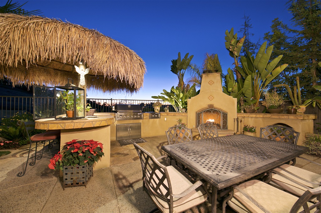 2436 Lapis Road Carlsbad, CA 92009 - Photo 20 of 25 Top of the line BBQ area, outdoor kitchen, alluring fireplace and custom palapa