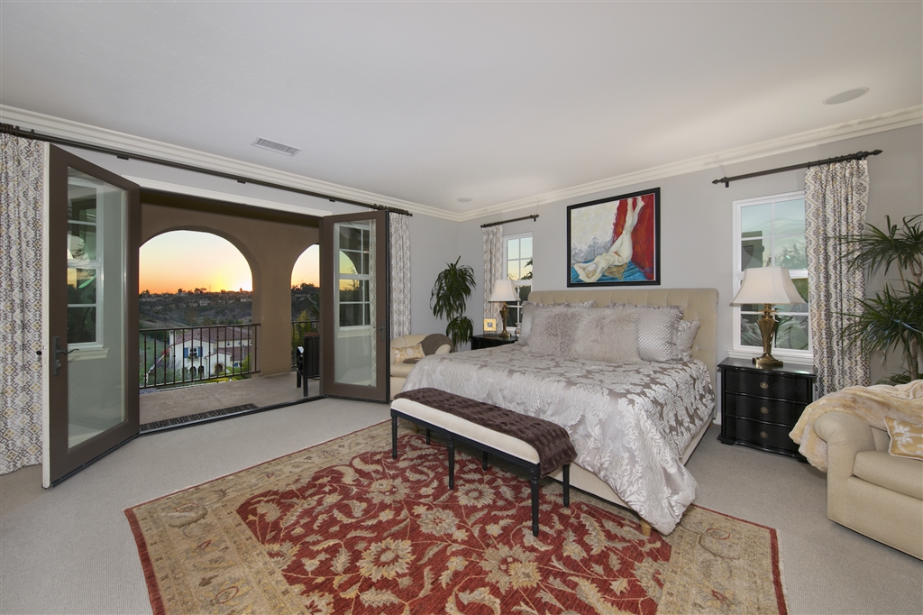 2436 Lapis Road Carlsbad, CA 92009 - Photo 9 of 25 Master bedroom with private balcony, fireplace, spa like master bath and spacious walk in closet.