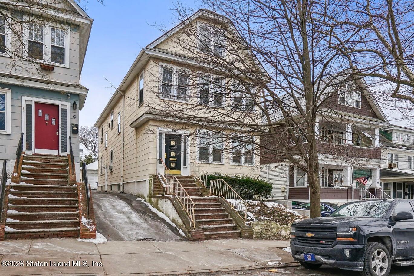 116 Silver Lake Road Staten Island, NY 10301 - Photo 1 of 36 a front view of a house with a yard