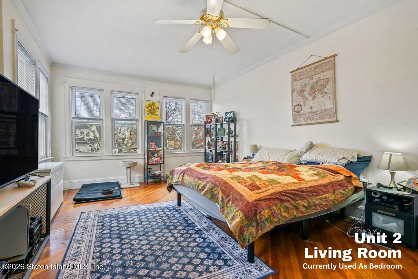 116 Silver Lake Road Staten Island, NY 10301 - Photo 17 of 36 a bedroom with bed and window