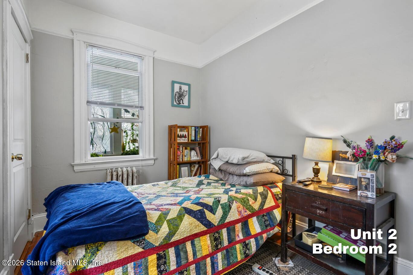 116 Silver Lake Road Staten Island, NY 10301 - Photo 26 of 36 a bedroom with bed and a window