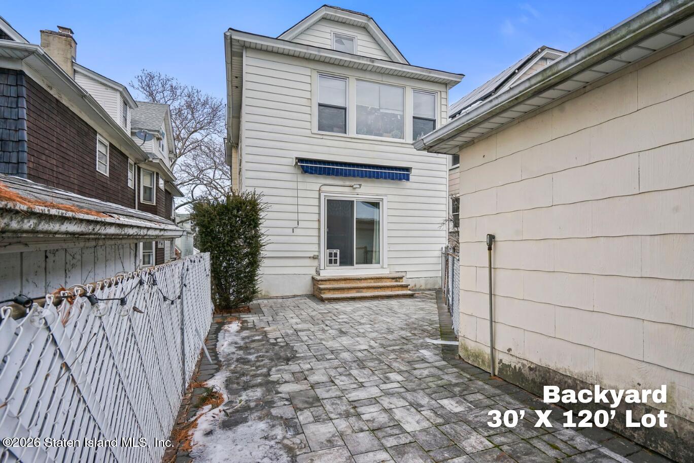 116 Silver Lake Road Staten Island, NY 10301 - Photo 33 of 36 a front view of a house with a garden