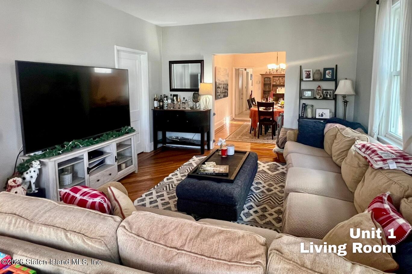 116 Silver Lake Road Staten Island, NY 10301 - Photo 5 of 36 a living room with furniture and a flat screen tv