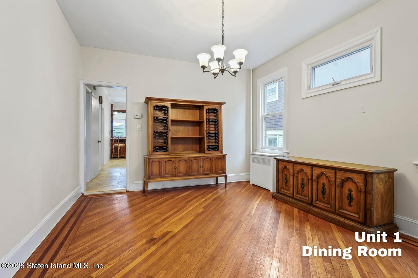 116 Silver Lake Road Staten Island, NY 10301 - Photo 7 of 36 a view of livingroom with hardwood floor and window