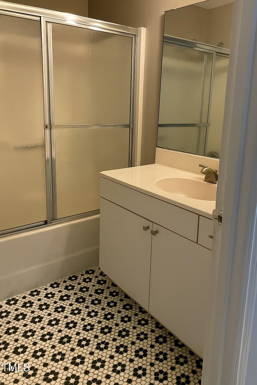 23 Dixie Trail Raleigh, NC 27607 - Photo 7 of 7 a bathroom with a sink and a mirror