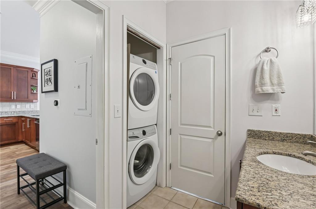 1055 Piedmont Avenue Northeast, Unit 309 Atlanta, GA 30309 - Photo 13 of 23 a bathroom with a sink and a washer dryer