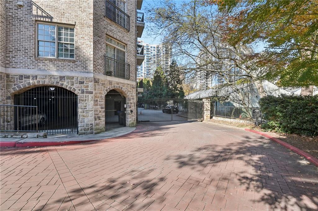 1055 Piedmont Avenue Northeast, Unit 309 Atlanta, GA 30309 - Photo 15 of 23 a view of a house with a yard and tree s