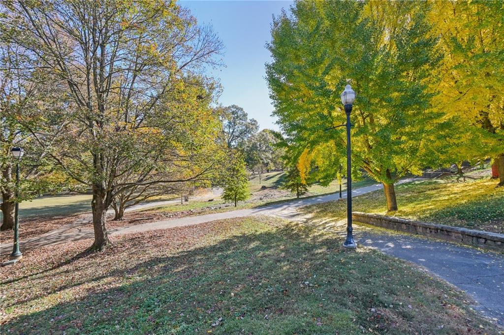 1055 Piedmont Avenue Northeast, Unit 309 Atlanta, GA 30309 - Photo 22 of 23 a view of a yard with trees