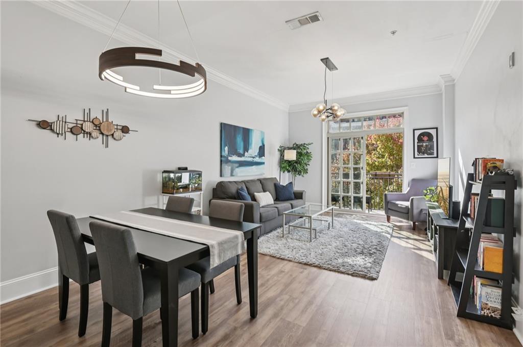 1055 Piedmont Avenue Northeast, Unit 309 Atlanta, GA 30309 - Photo 5 of 23 a view of a livingroom with furniture window and wooden floor
