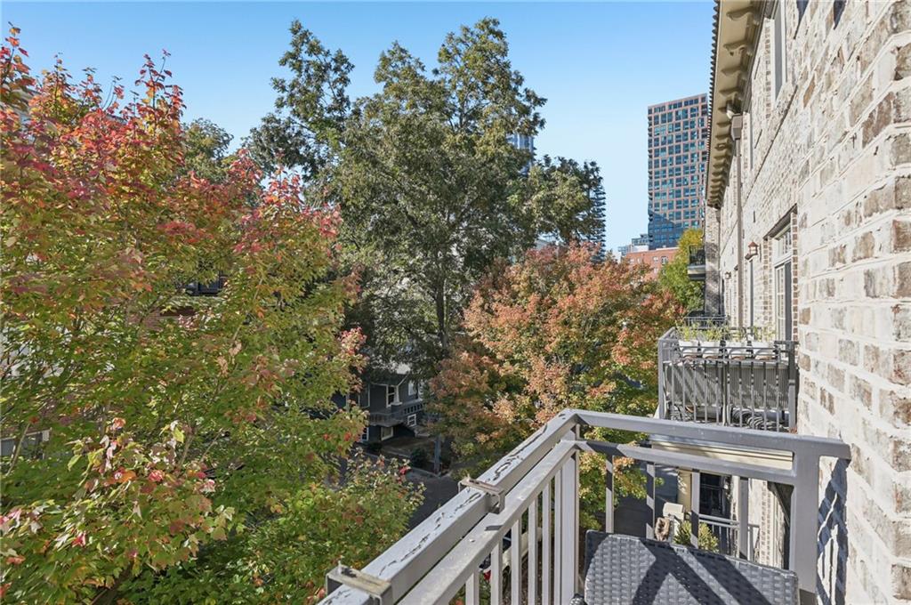 1055 Piedmont Avenue Northeast, Unit 309 Atlanta, GA 30309 - Photo 9 of 23 a view of balcony with wooden floor and fence