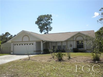 18266 Apple Road Fort Myers, FL 33967 - Photo 1 of 10 a front view of a house with a yard