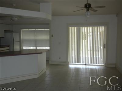 18266 Apple Road Fort Myers, FL 33967 - Photo 3 of 10 wooden floor in an empty room with a window