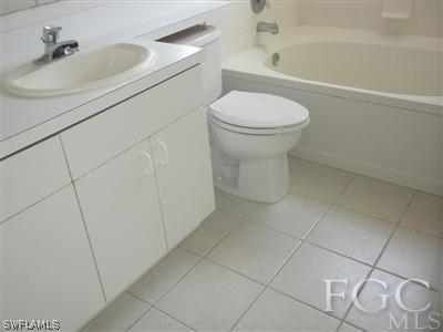 18266 Apple Road Fort Myers, FL 33967 - Photo 6 of 10 a bathroom with a sink and a toilet