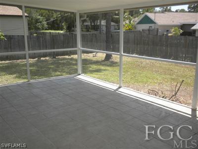 18266 Apple Road Fort Myers, FL 33967 - Photo 9 of 10 a view of a glass door with a yard