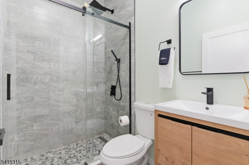 16 Eagles Street Newark, NJ 07102 - Photo 13 of 35 a bathroom with a sink toilet and shower