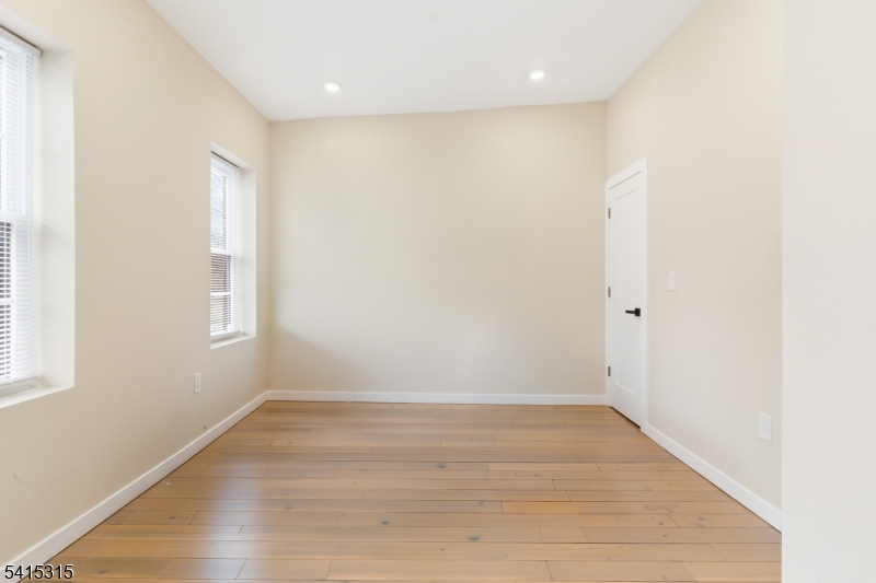 16 Eagles Street Newark, NJ 07102 - Photo 14 of 35 a view of room with window and wooden floor