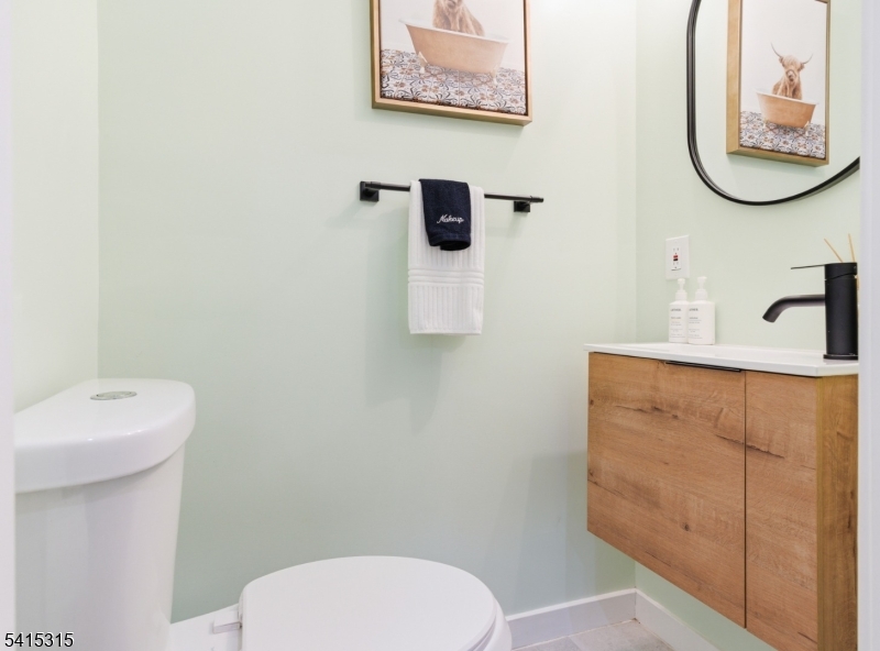 16 Eagles Street Newark, NJ 07102 - Photo 15 of 35 a bathroom with a toilet sink and mirror