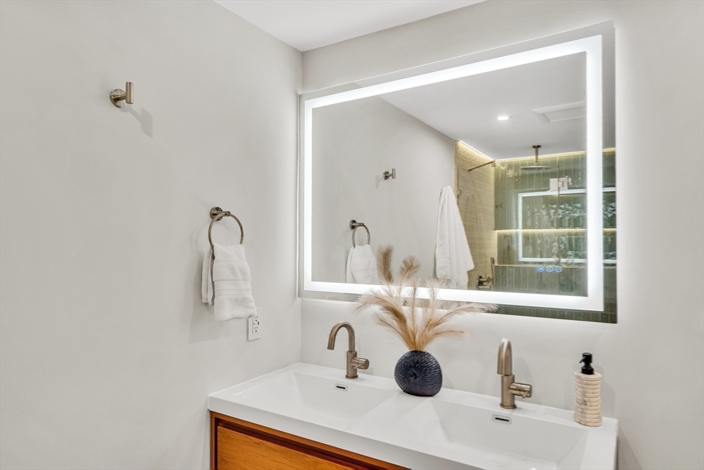 70 Birch Hill Road Belmont, MA 02478 - Photo 31 of 41 a bathroom with a sink and a mirror
