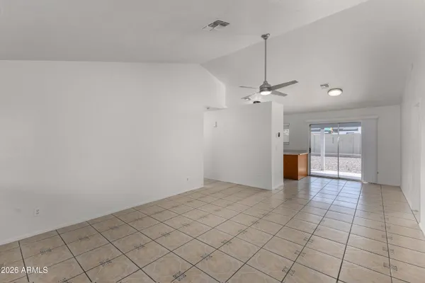 a kitchen with stainless steel appliances a refrigerator and a stove top oven