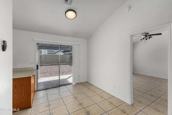 a view of kitchen with granite countertop cabinets and sink
