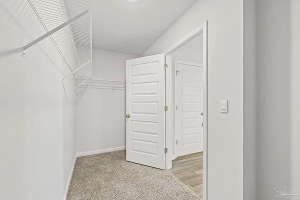 a bathroom with a granite countertop sink a mirror and a shower